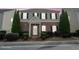 Charming two-story brick home with manicured landscaping and traditional shutters on a cloudy day at 3272 Tiara Sw Cir, Atlanta, GA 30311