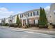 Inviting two-story townhouse showcasing well-kept landscaping and black shutters at 3272 Tiara Sw Cir, Atlanta, GA 30311