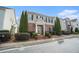 Charming brick home with black shutters, a covered porch, and manicured landscaping at 3272 Tiara Sw Cir, Atlanta, GA 30311