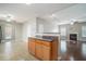 Open kitchen area with tile flooring, seamlessly connecting to the living area with hardwood floors at 3272 Tiara Sw Cir, Atlanta, GA 30311