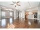 Open-concept living area with hardwood floors flowing into the kitchen, featuring ample space and natural light at 3272 Tiara Sw Cir, Atlanta, GA 30311