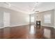 Bright living room featuring hardwood floors, fireplace, and large windows for plenty of sunlight at 3272 Tiara Sw Cir, Atlanta, GA 30311