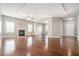 Spacious living room with hardwood floors, fireplace, ample natural light, and neutral paint at 3272 Tiara Sw Cir, Atlanta, GA 30311