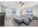Comfortable main bedroom with tray ceiling, carpet flooring, and bright, neutral paint at 3272 Tiara Sw Cir, Atlanta, GA 30311
