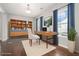 Bright office space featuring a modern desk, shelving, and hardwood floors at 3272 Tiara Sw Cir, Atlanta, GA 30311