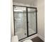 Modern bathroom features a glass-enclosed shower with marble-like tile and dark fixtures at 5447 Blossomwood Sw Trl, Mableton, GA 30126