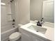Bathroom featuring shower-tub combo, sink, and toilet at 5447 Blossomwood Sw Trl, Mableton, GA 30126
