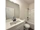 Bright bathroom with a white vanity, sleek fixtures, and a shower-tub combination at 5447 Blossomwood Sw Trl, Mableton, GA 30126
