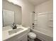 Clean bathroom with a white vanity, modern fixtures, and a tub with shower combination at 5447 Blossomwood Sw Trl, Mableton, GA 30126