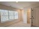 Bedroom features large window, neutral walls, and a closet at 5447 Blossomwood Sw Trl, Mableton, GA 30126