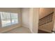 Inviting bedroom with large window offering natural light and a neutral carpet at 5447 Blossomwood Sw Trl, Mableton, GA 30126