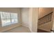Bright bedroom with a large window and neutral carpeting creating a warm, inviting space at 5447 Blossomwood Sw Trl, Mableton, GA 30126