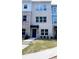 Charming townhouse with a landscaped front yard and classic brick facade at 5447 Blossomwood Sw Trl, Mableton, GA 30126