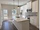 Modern kitchen featuring a center island, stainless steel appliances, and stylish pendant lighting at 5447 Blossomwood Sw Trl, Mableton, GA 30126