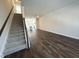Spacious living room features new hardwood floors, stairs, and bright, open layout to the kitchen at 5447 Blossomwood Sw Trl, Mableton, GA 30126