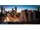 The Atlanta skyline against a twilight backdrop, with the 'ATL' logo in the foreground at 5447 Blossomwood Sw Trl, Mableton, GA 30126