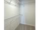 Walk-in closet with white wire shelving at 5447 Blossomwood Sw Trl, Mableton, GA 30126