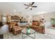 Open concept living room and kitchen area with modern furniture and a view of the dining room at 599 Collections Dr, Lawrenceville, GA 30043