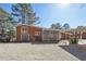 Large backyard featuring a carport, driveway, and back of the house at 3035 Mclendon Nw Cir, Atlanta, GA 30318