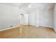 Bright bedroom with hardwood floors, white walls, closet, and a ceiling fan, creating a tranquil and inviting space at 3035 Mclendon Nw Cir, Atlanta, GA 30318