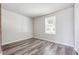 Cozy bedroom with modern vinyl floors, natural light, and a calming neutral color scheme, perfect for rest at 3035 Mclendon Nw Cir, Atlanta, GA 30318
