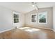 Sunlit bedroom with three windows, vaulted ceiling and hardwood floors at 3035 Mclendon Nw Cir, Atlanta, GA 30318