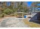 Backyard view of the carport, driveway, and side of the house at 3035 Mclendon Nw Cir, Atlanta, GA 30318