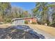 Inviting home with a long driveway and well-kept lawn, ideal for outdoor activities and entertaining guests at 3035 Mclendon Nw Cir, Atlanta, GA 30318