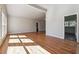 Bright living room boasting hardwood floors and lots of natural light streaming in through large windows at 3035 Mclendon Nw Cir, Atlanta, GA 30318