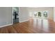 Inviting living area with hardwood floors, natural light, and convenient access to the kitchen and other living spaces at 3035 Mclendon Nw Cir, Atlanta, GA 30318