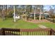 Home's lush backyard features a small storage shed surrounded by tall trees at 322 Foxfire Sw Dr, Smyrna, GA 30082