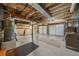 Unfinished basement space with exposed ceiling and garage doors at 322 Foxfire Sw Dr, Smyrna, GA 30082