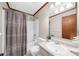 Bathroom featuring a shower-tub combo and vanity at 322 Foxfire Sw Dr, Smyrna, GA 30082