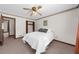 Bright bedroom features a ceiling fan, closet, and neutral carpeting at 322 Foxfire Sw Dr, Smyrna, GA 30082