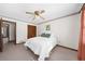 Cozy bedroom features a ceiling fan, closet, and neutral carpeting at 322 Foxfire Sw Dr, Smyrna, GA 30082