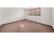 Simple bedroom with neutral walls, carpet flooring, and natural light from the window at 322 Foxfire Sw Dr, Smyrna, GA 30082