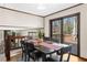 Dining room showcasing wood floors, access to deck via sliding doors, and seating for six at 322 Foxfire Sw Dr, Smyrna, GA 30082