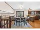 Dining room area featuring an open plan, wood floors, a view to the outside, and seating for six at 322 Foxfire Sw Dr, Smyrna, GA 30082