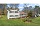 A lovely home with a well-maintained lawn, featuring a covered porch and charming details at 322 Foxfire Sw Dr, Smyrna, GA 30082