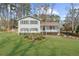Charming two-story home with a well-manicured lawn and welcoming front porch at 322 Foxfire Sw Dr, Smyrna, GA 30082