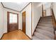 Warm and inviting foyer with carpeted stairs leading to the upper level at 322 Foxfire Sw Dr, Smyrna, GA 30082