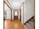 Bright and airy foyer featuring hardwood floors, a front door, and stairs to the upper level at 322 Foxfire Sw Dr, Smyrna, GA 30082