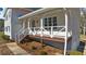 Charming front porch with classic railings and detailed trim, perfect for relaxing and welcoming guests at 322 Foxfire Sw Dr, Smyrna, GA 30082