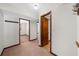 Hallway with multiple doors, carpet flooring, and access to different rooms at 322 Foxfire Sw Dr, Smyrna, GA 30082