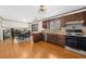 Open concept kitchen with stainless appliances and an adjacent dining area at 322 Foxfire Sw Dr, Smyrna, GA 30082