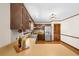 Kitchen featuring stainless steel appliances, breakfast bar, wood cabinets, and wood floors at 322 Foxfire Sw Dr, Smyrna, GA 30082
