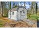 A well-maintained storage shed offers extra space with double doors and a secure structure at 322 Foxfire Sw Dr, Smyrna, GA 30082