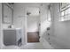 Bathroom featuring modern vanity, soaking tub, and tiled showerhead at 3280 Hazelwood Sw Dr, Atlanta, GA 30311