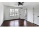 Bright bedroom with hardwood floors, ceiling fan, and trim work with backyard views at 3280 Hazelwood Sw Dr, Atlanta, GA 30311