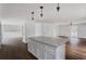 Bright, updated kitchen with white countertops, stainless steel appliances, and views into the living room at 3280 Hazelwood Sw Dr, Atlanta, GA 30311
